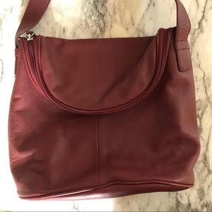 Burgundy handbag with shoulder strap